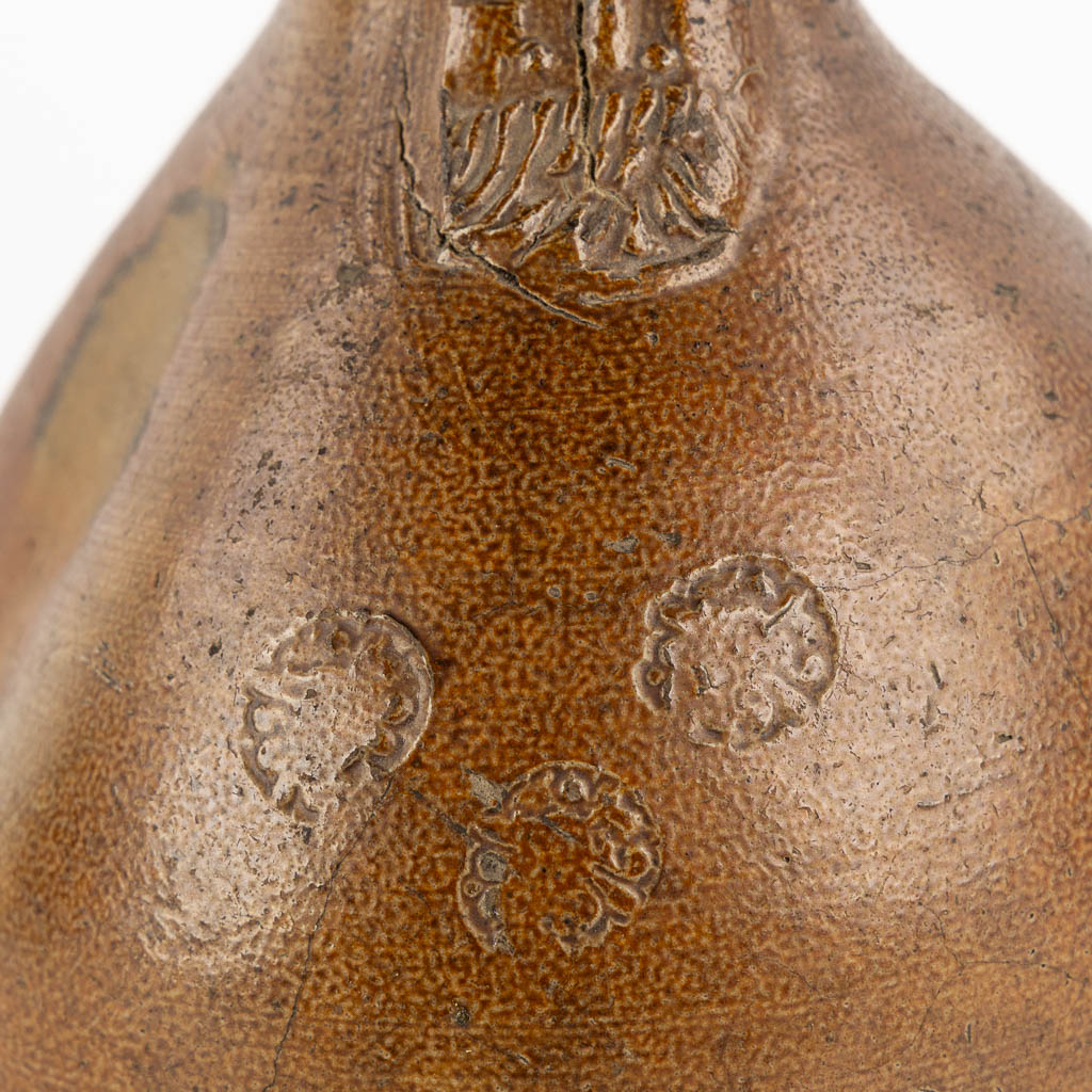 An antique Bartmann jug with three stamps, 17th C. (H:27 x D:17 cm)