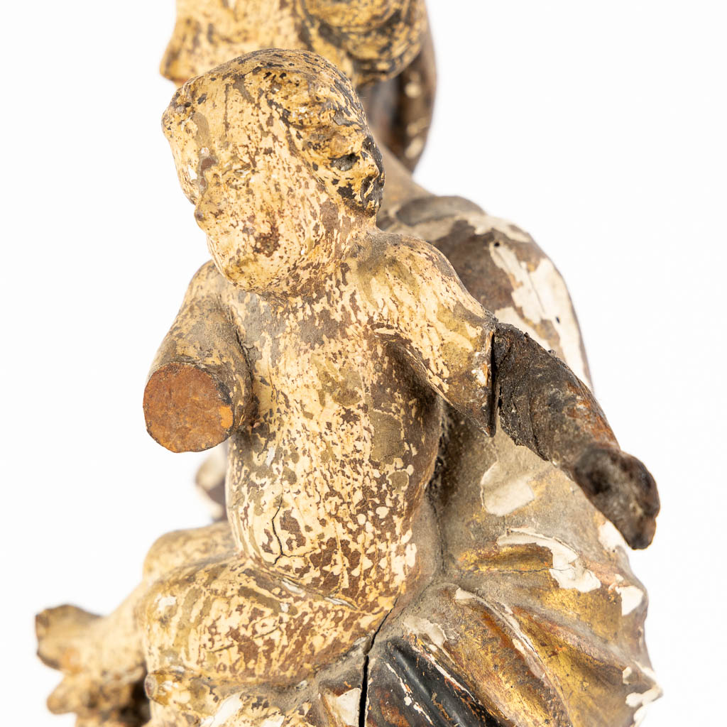 An antique wood-sculptured figurine of Madonna with a Child. 17th/18th C. (L:11,5 x W:16 x H:45 cm)