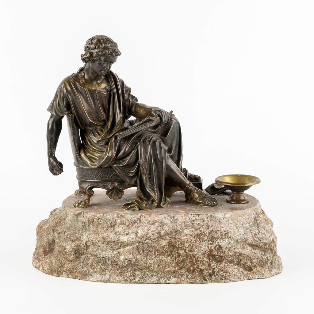 The Reading Roman, patinated bronze. 19th C. (L:23 x W:38 x H:34 cm)