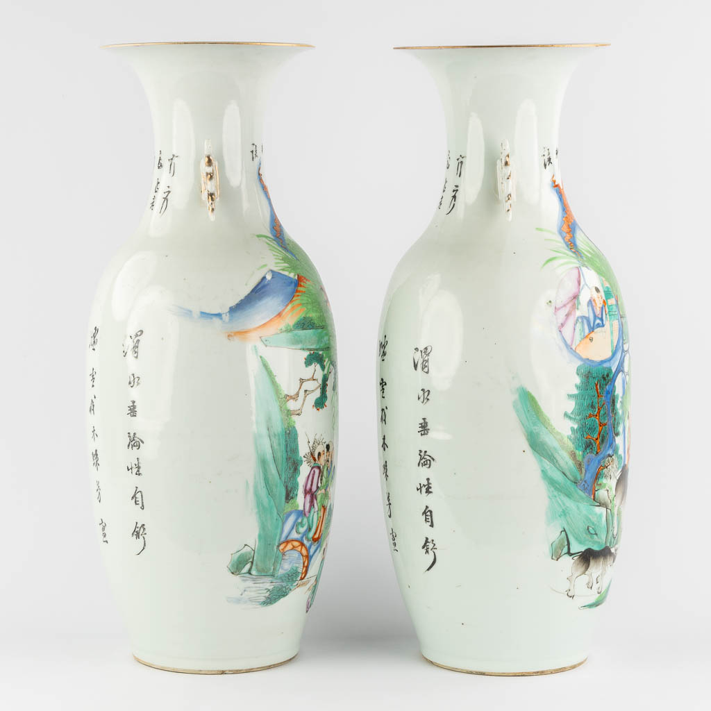 A pair of Chinese vases, decorated with playing children and kaligraphic texts. (H:59 x D:23 cm)