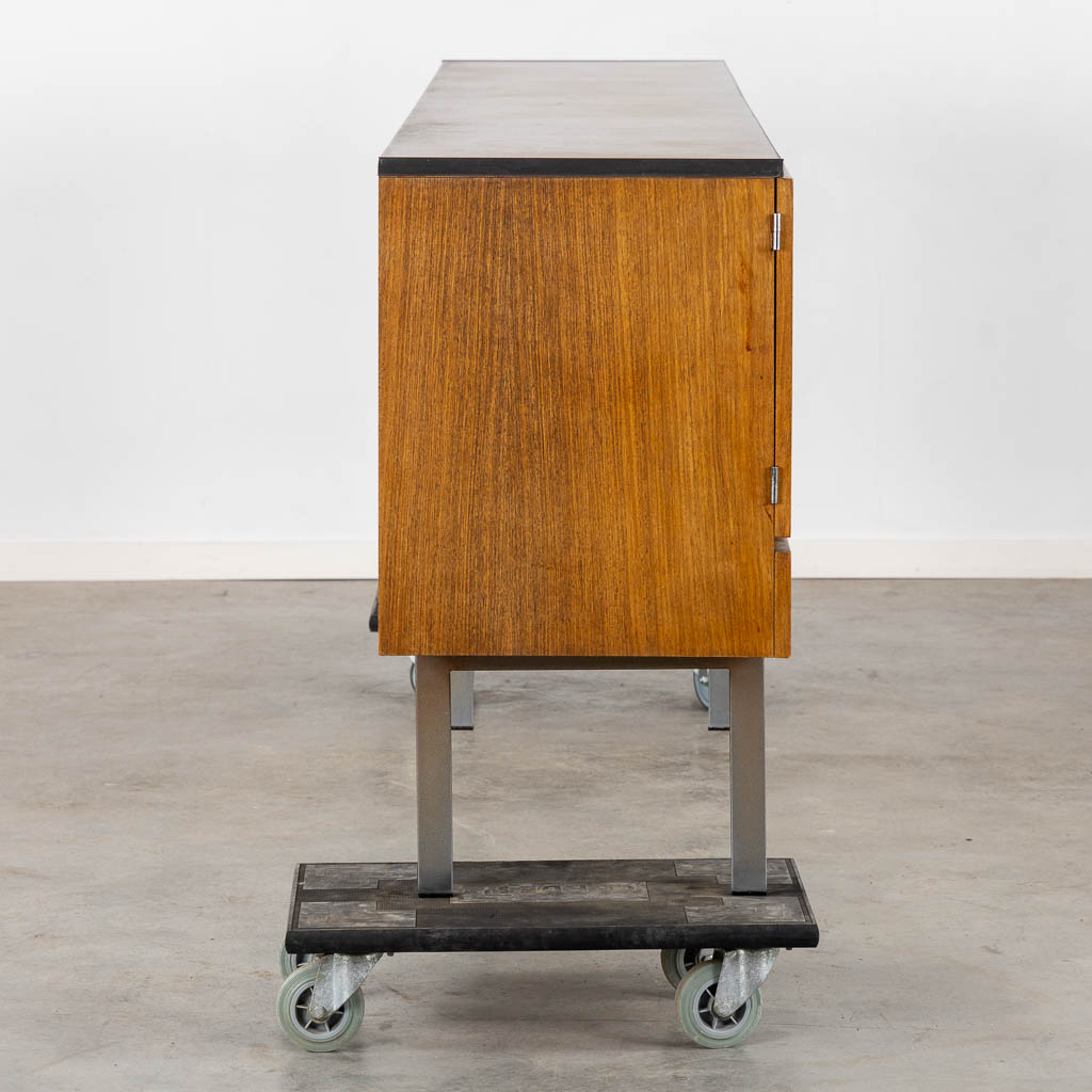 A mid-century sideboard, veneer and chomed metal. By Roger De Winter. (L:46 x W:237 x H:84 cm)