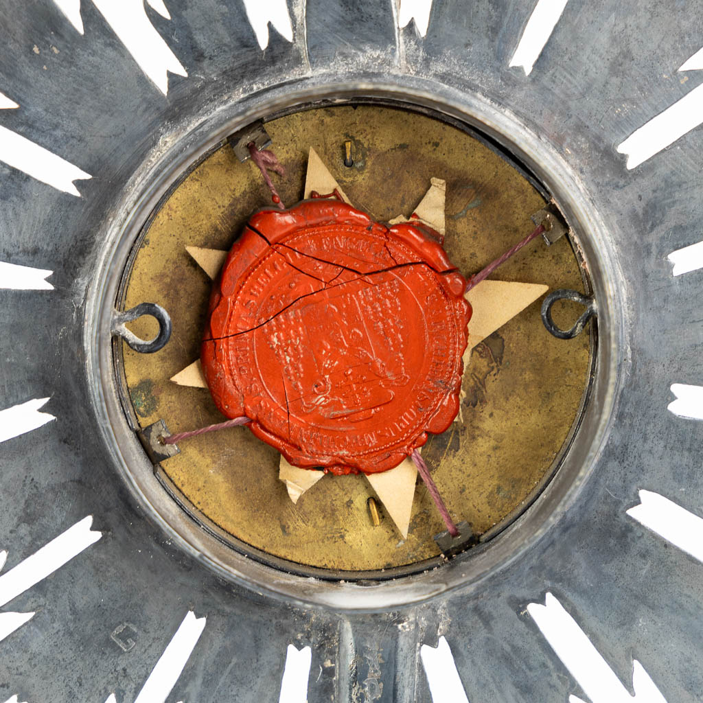 A small sunburst monstrance with a relic of the True Cross. (H:30,5 x D:12,5 cm)