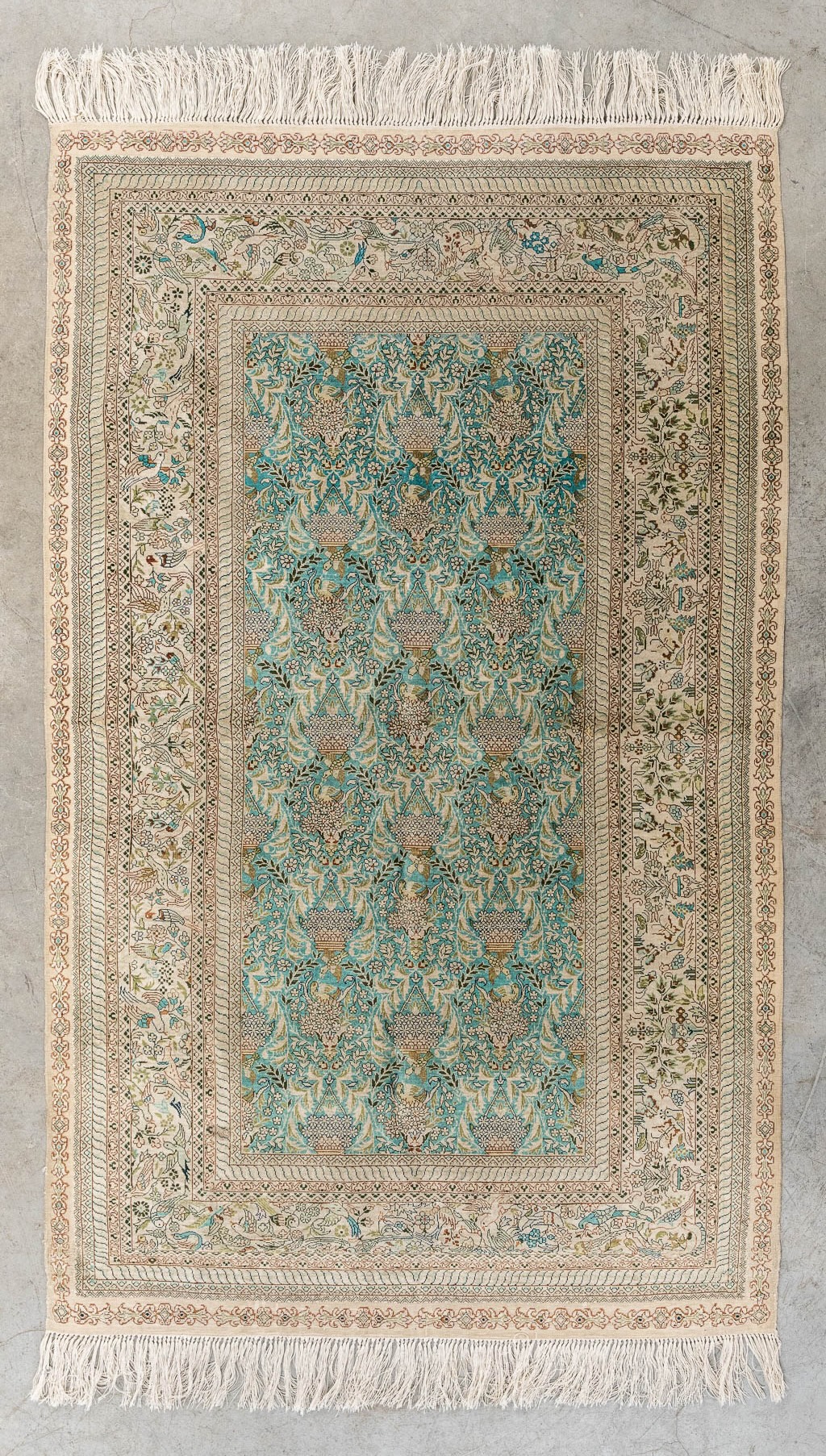 An Oriental hand-made carpet, fauna and flora decor, silk. (L:153 x W:93 cm)