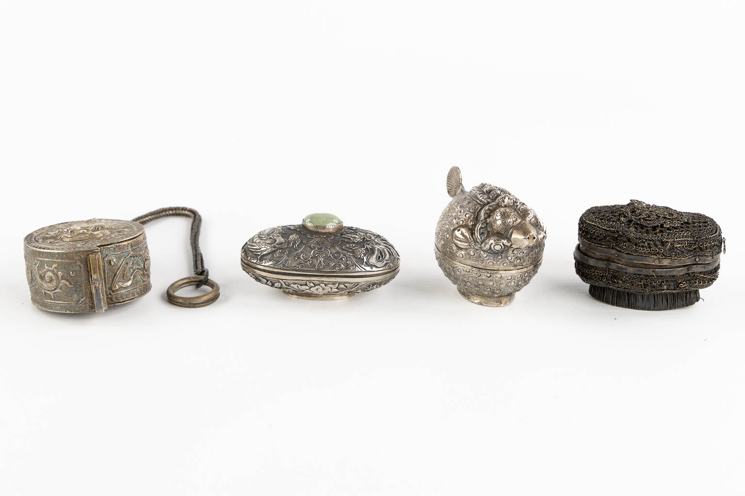 Fourteen Islamic and Indian Amulet or Trinklet boxes, Silver and silver-plate. 19th/20th C. (L:9,5 x W:16,5 x H:2,5 cm)