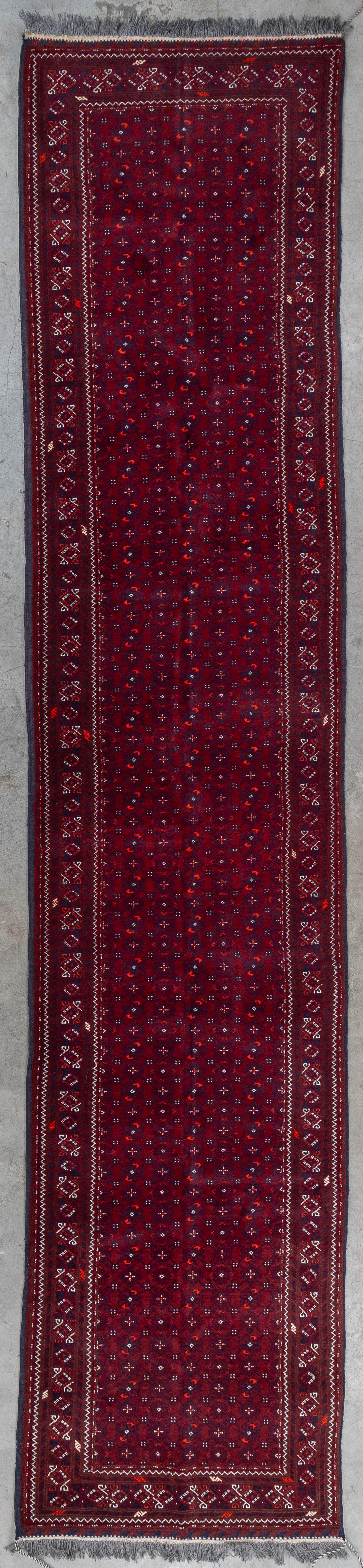 An Oriental hand-made runner, Afghan. (L:391 x W:85 cm)