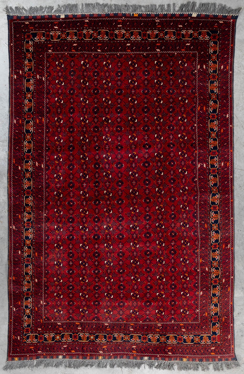 An Oriental hand-made carpet, Afghan. (L:290 x W:193 cm)