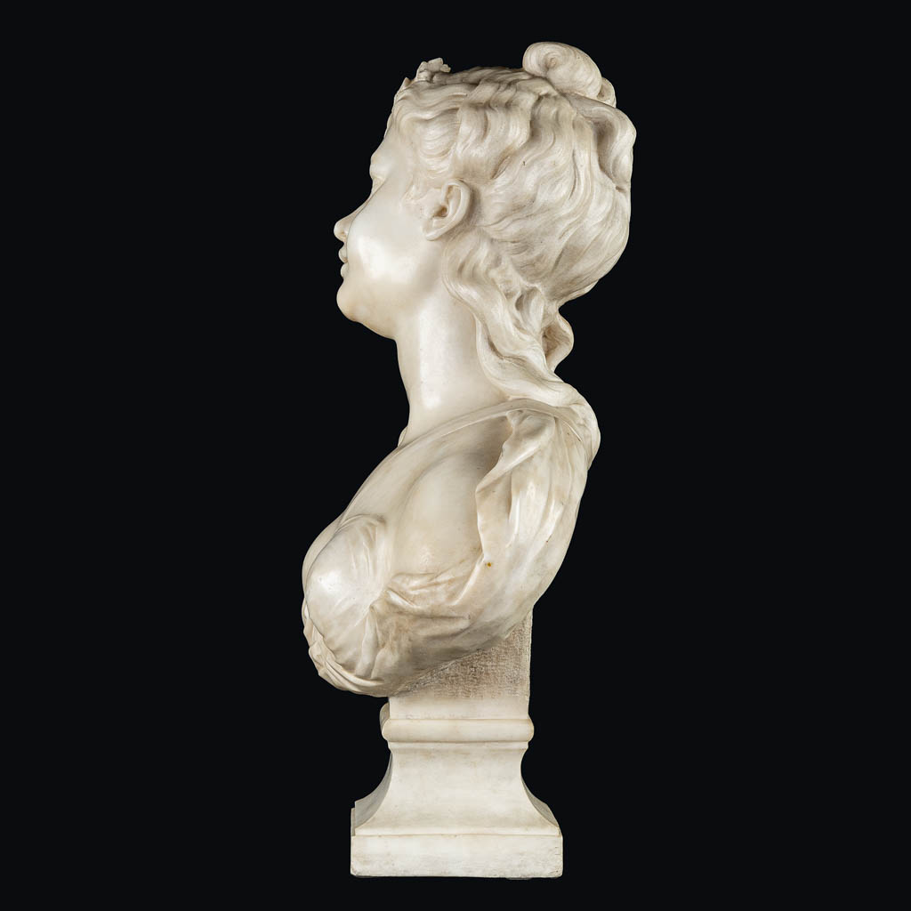 An elegant bust of a half-naked lady, sculptured marble. 19th C. (L:26 x W:45 x H:64 cm)