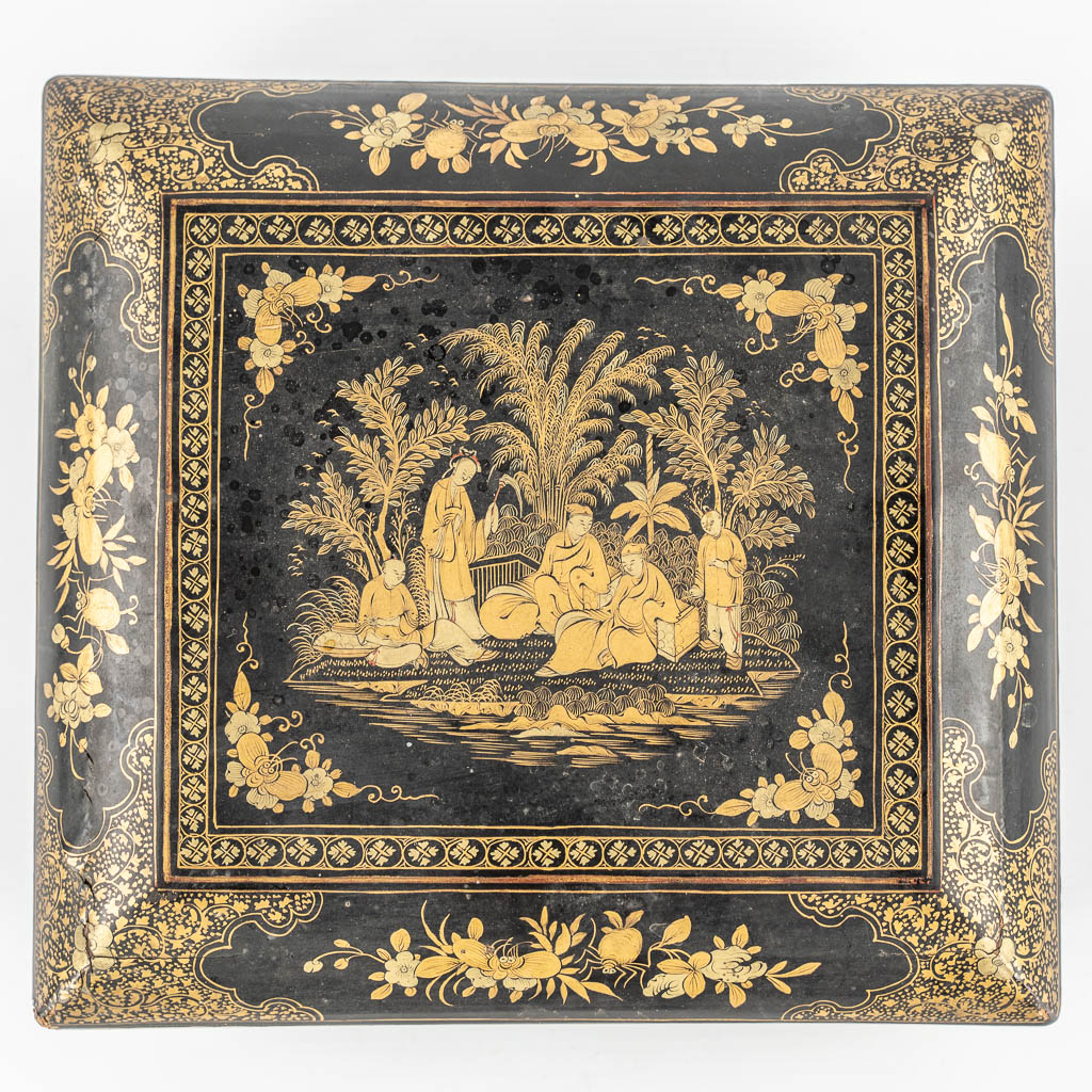 A Chinese Canton export game box, lacquered with hand-painted decors. 