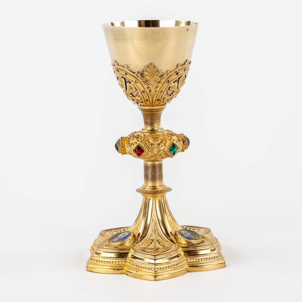 A Gothic Revival chalice with enamel plaques, cabochons. Silver Cuppa, Gilt brass, 19th C.