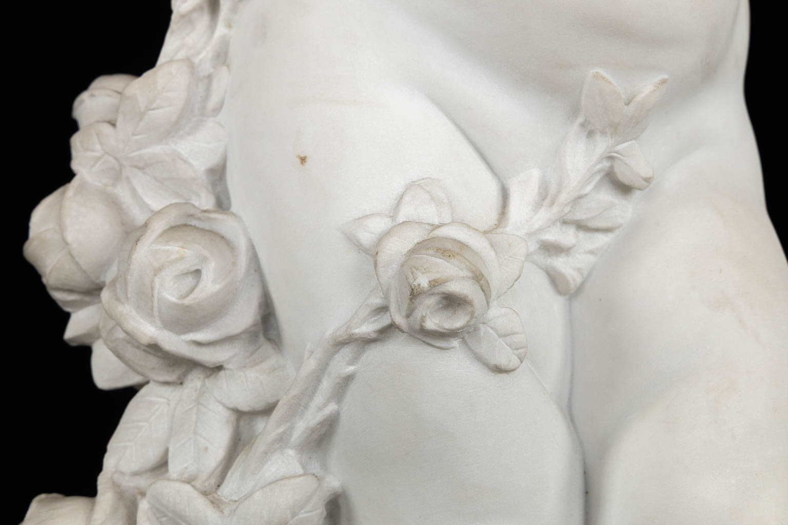 Boy with a rose, a Carrara marble sculpture, signed Vanet. 19th C. (L:35 x W:42 x H:92 cm)