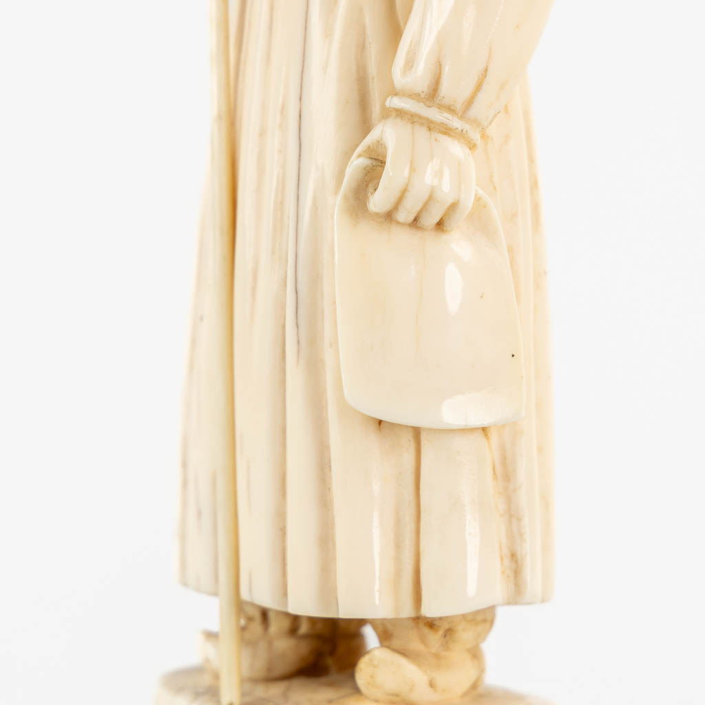 An antique Ivory sculptured figurine of a 