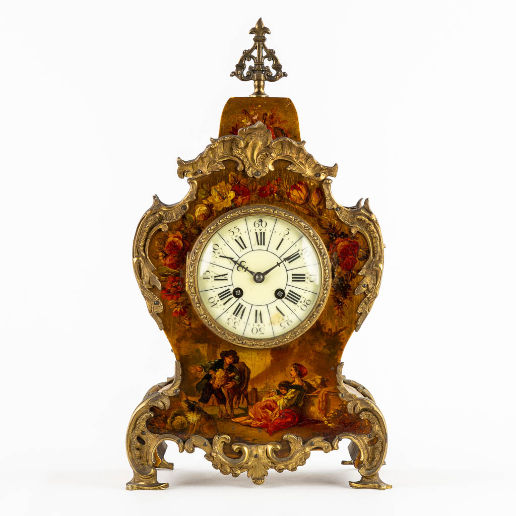 A cartel clock, hand-painted floral decor, mounted with bronze. (c.1900). 