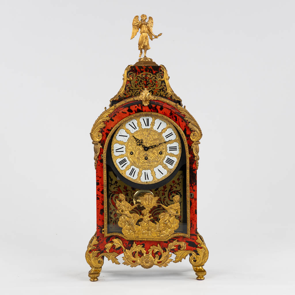 A large cartel clock, Faux Boulle in a Napoleon 3 style, mounted with gilt bronze. 20th C. (L:15 x W:40 x H:85 cm)