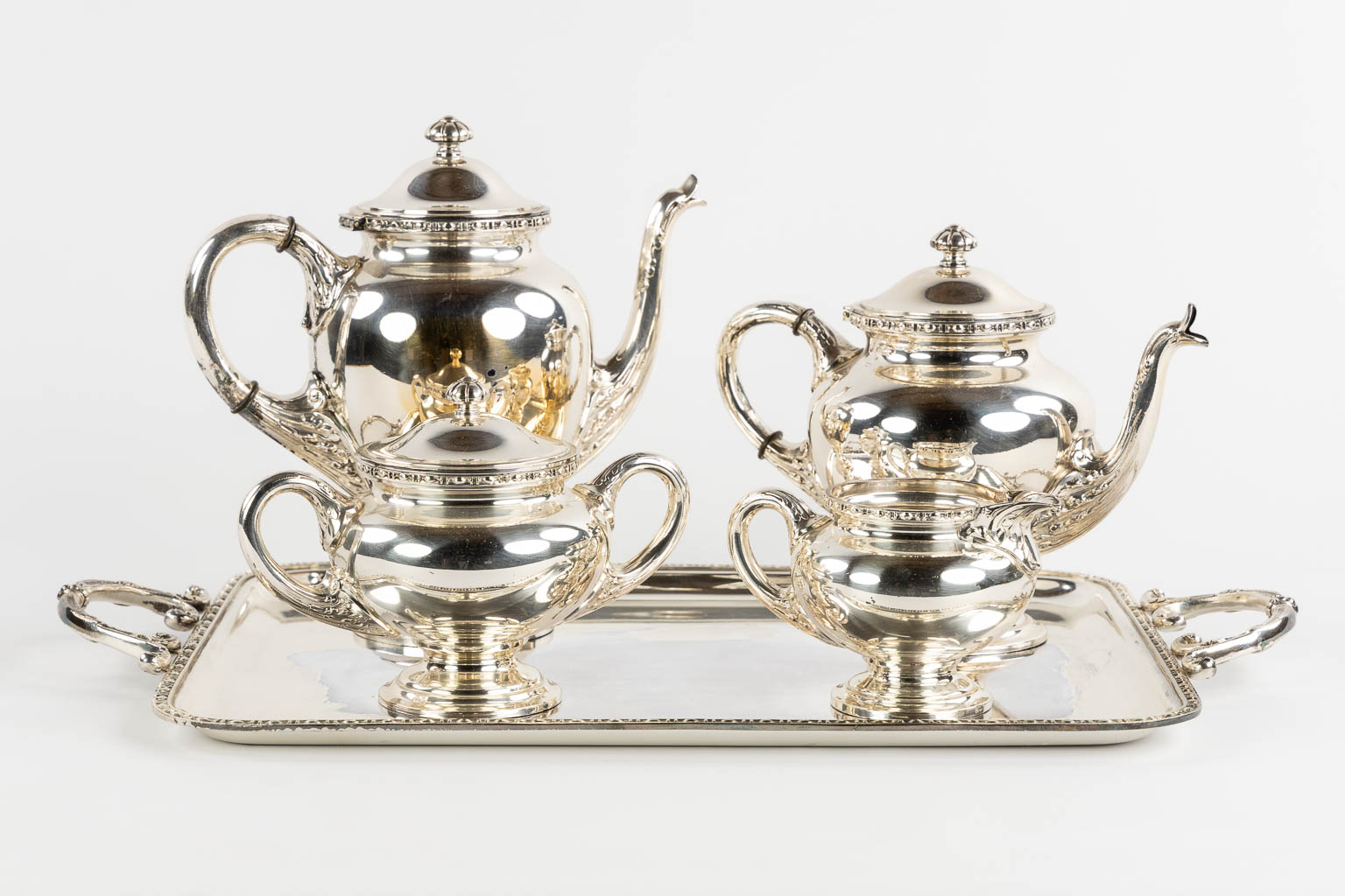 Wiskemann, a silver-plated coffee and tea service, addded are two serving bowls. (L:35,5 x W:57 cm)