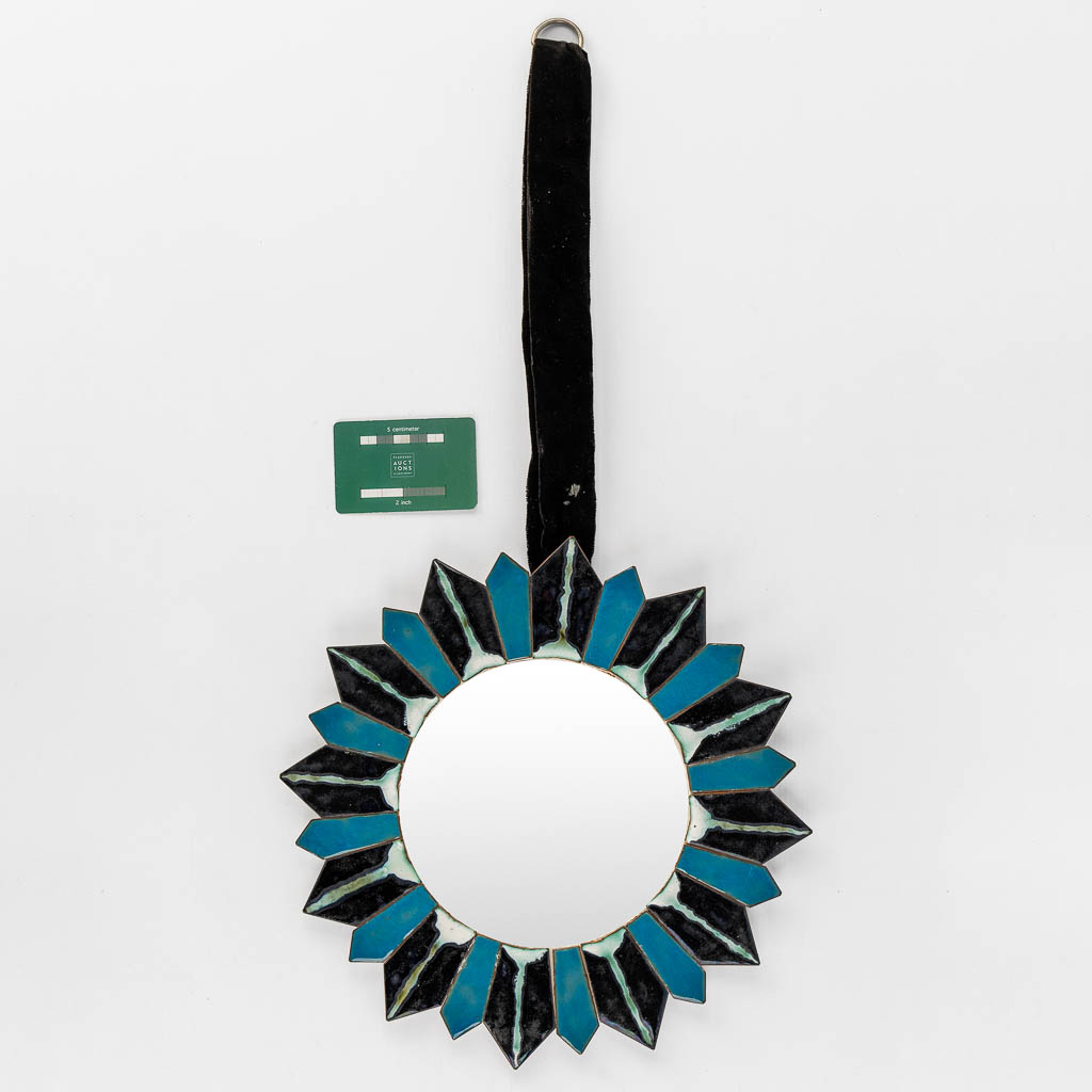 A mid-century Sunburst mirror, blue and black enamel on copper, glass. (D:31,5 cm)