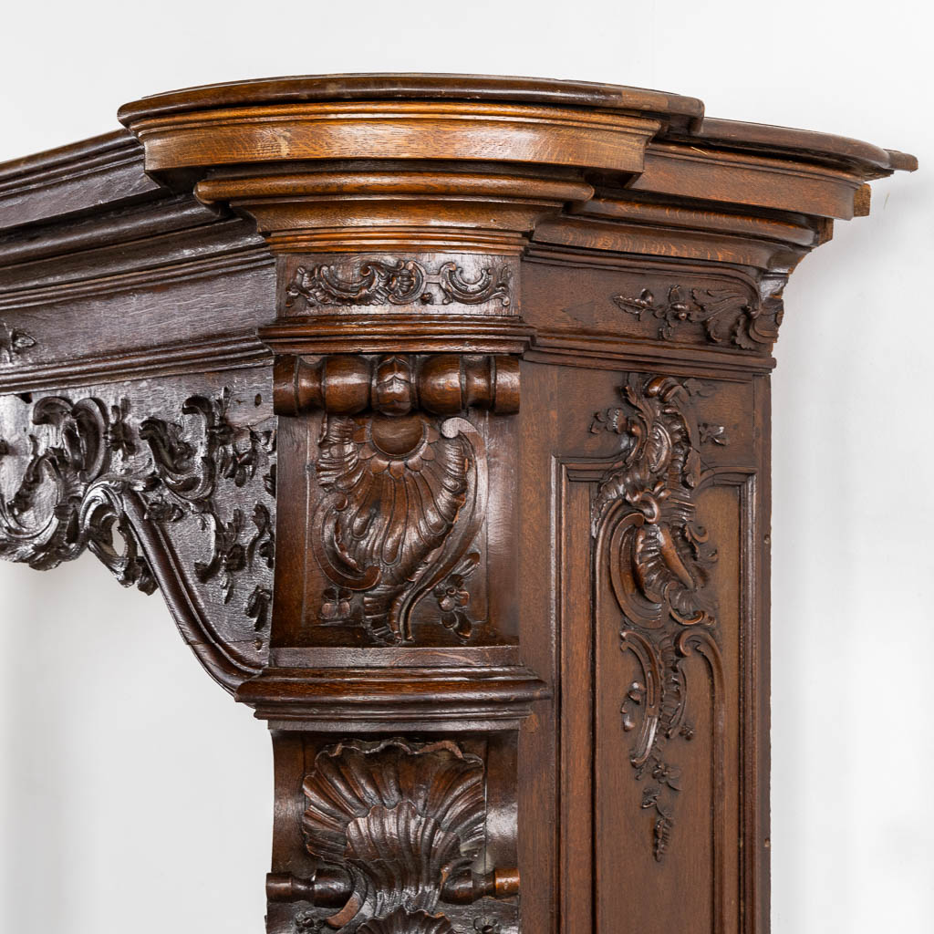 A large sculptured fireplace mantle, Liège, 18th C. (L:55 x W:209 x H:170 cm)