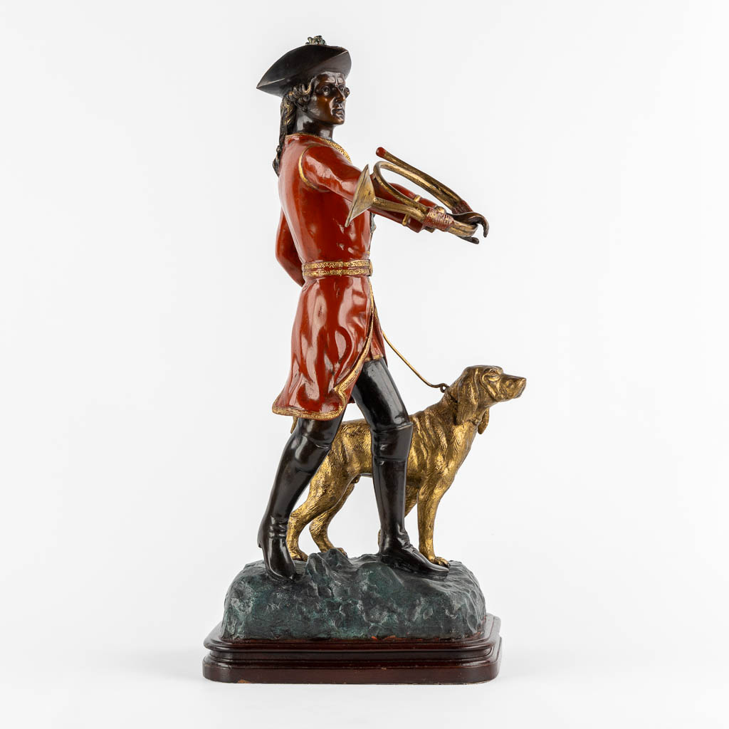 After Pierre Jules Mène, Hunter with his horn and dog. Patinated bronze. (L:29 x W:35 x H:62 cm)