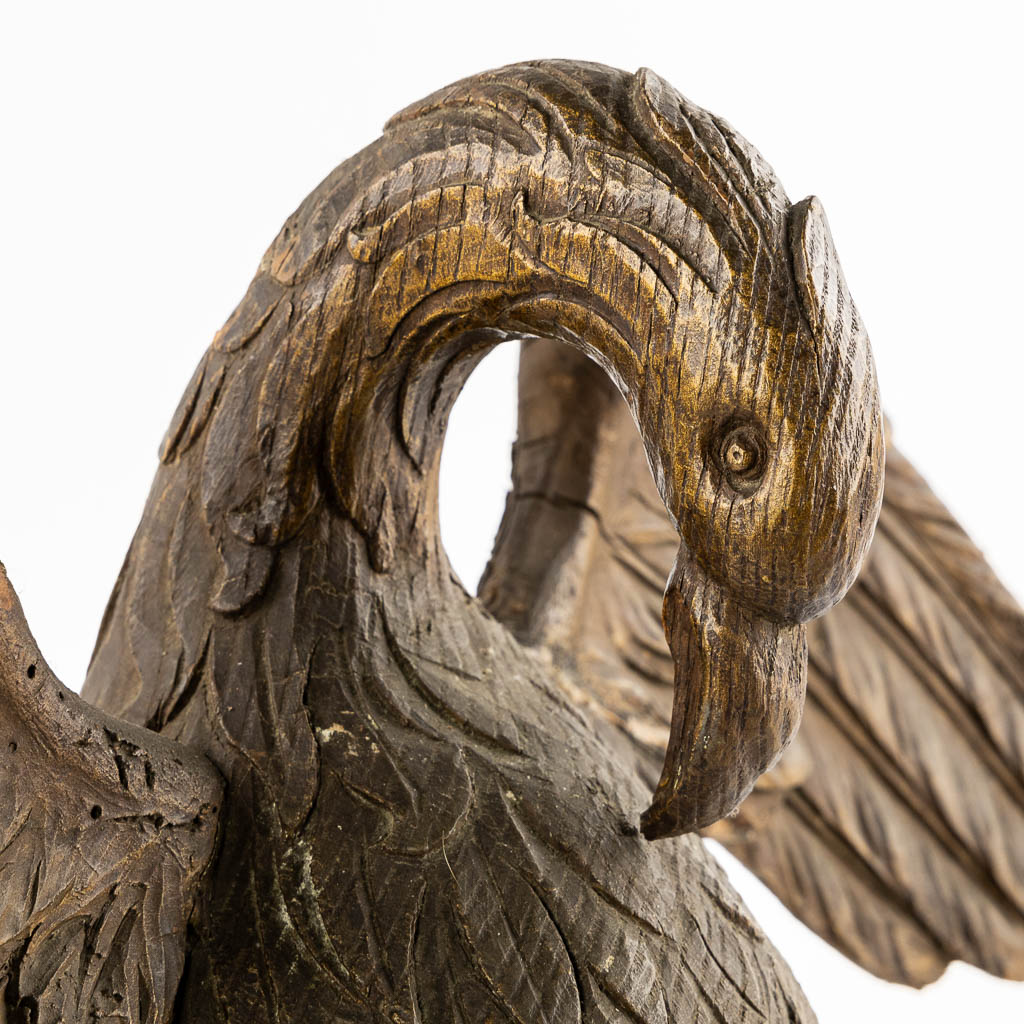 An antique wood-sculptured 'Pelican With Chicks'. 18th/19th C.