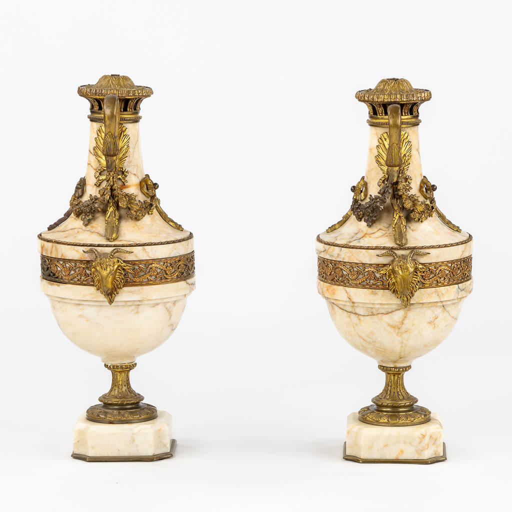 A pair of marble cassolettes, marble mounted with bronze in Louis XVI style. Ram