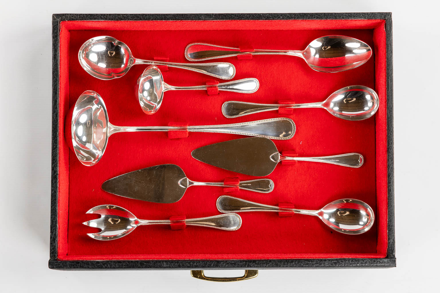 A 184-piece silver-plated cutlery with a Perles decor. (L:36 x W:47 x H:37 cm)