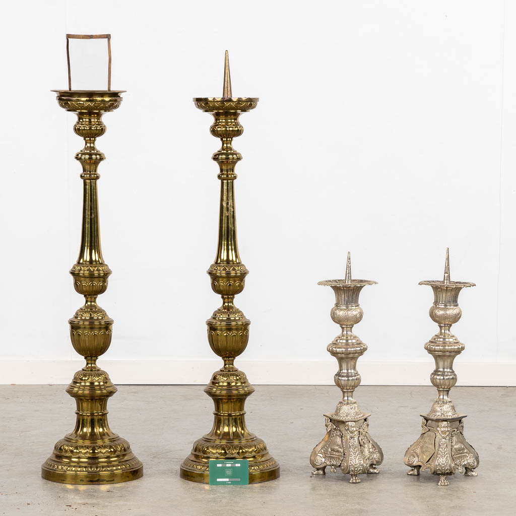 A pair of silver-plated church chandelsticks, added a pair of brass candelabra. (H:92 cm)