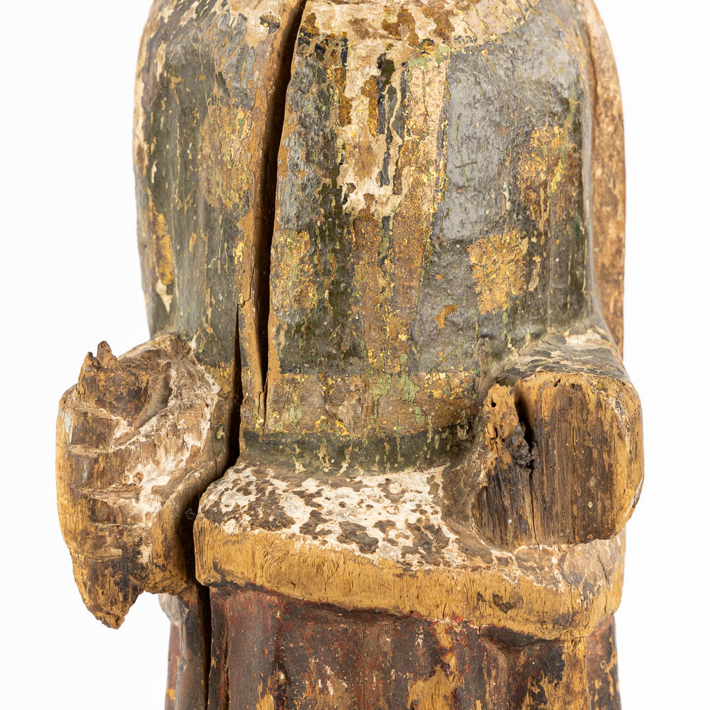 An antique wood sculpture of a Deacon, Roman period, possibly Catalonia. 12th C. (L:14 x W:15 x H:57 cm)