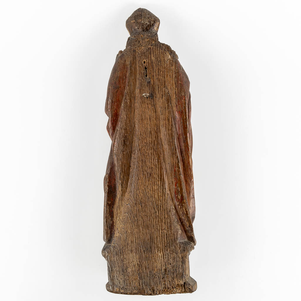 An antique wood-sculptured figurine of Saint Hubert of Liège, 17th/18th C.