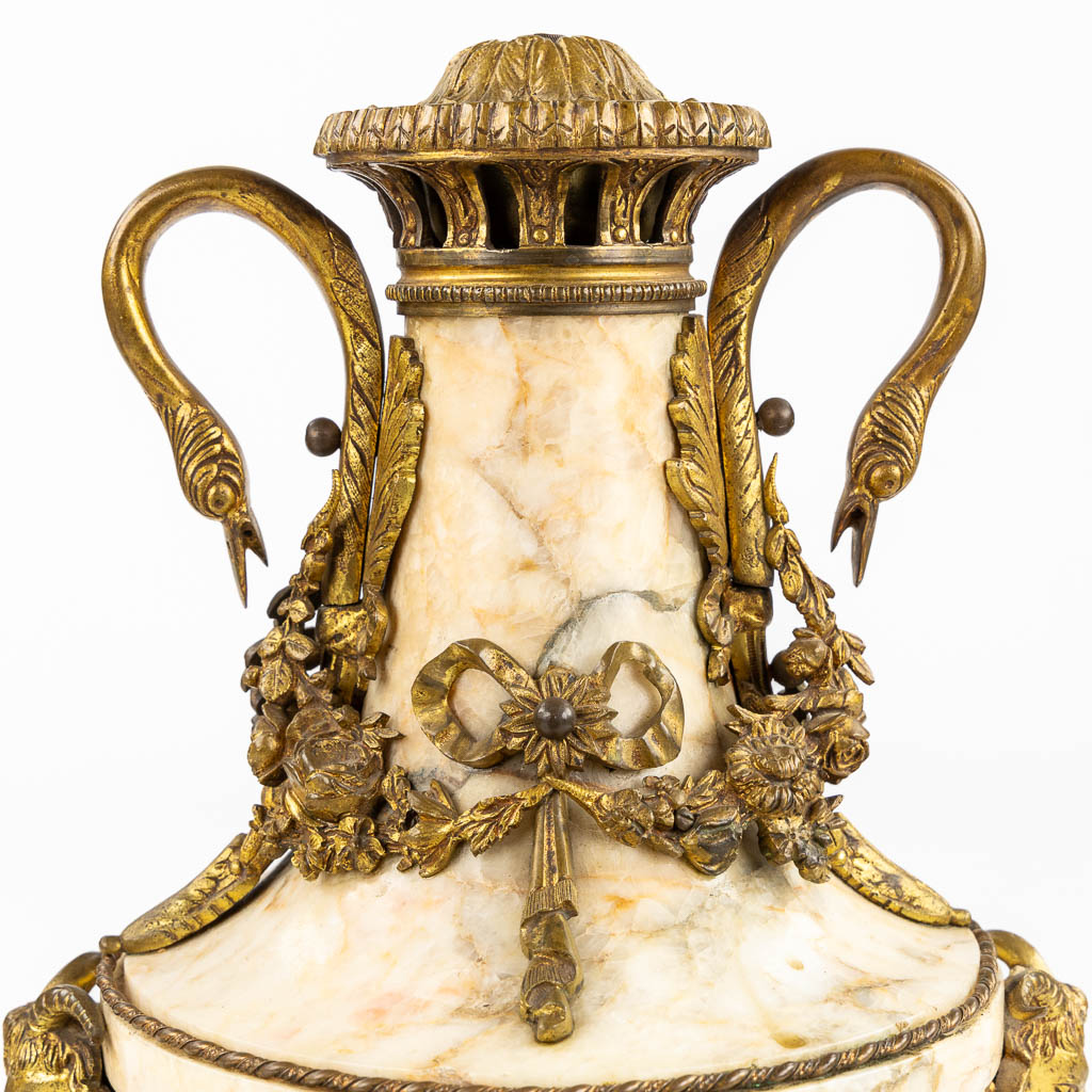 A pair of marble cassolettes, marble mounted with bronze in Louis XVI style. Ram