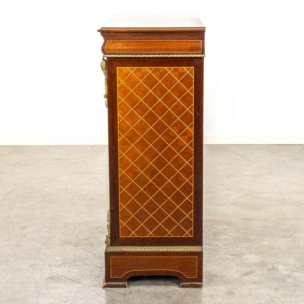 A single door cabinet, marquetry inlay mounted with bronze. 20th C. 