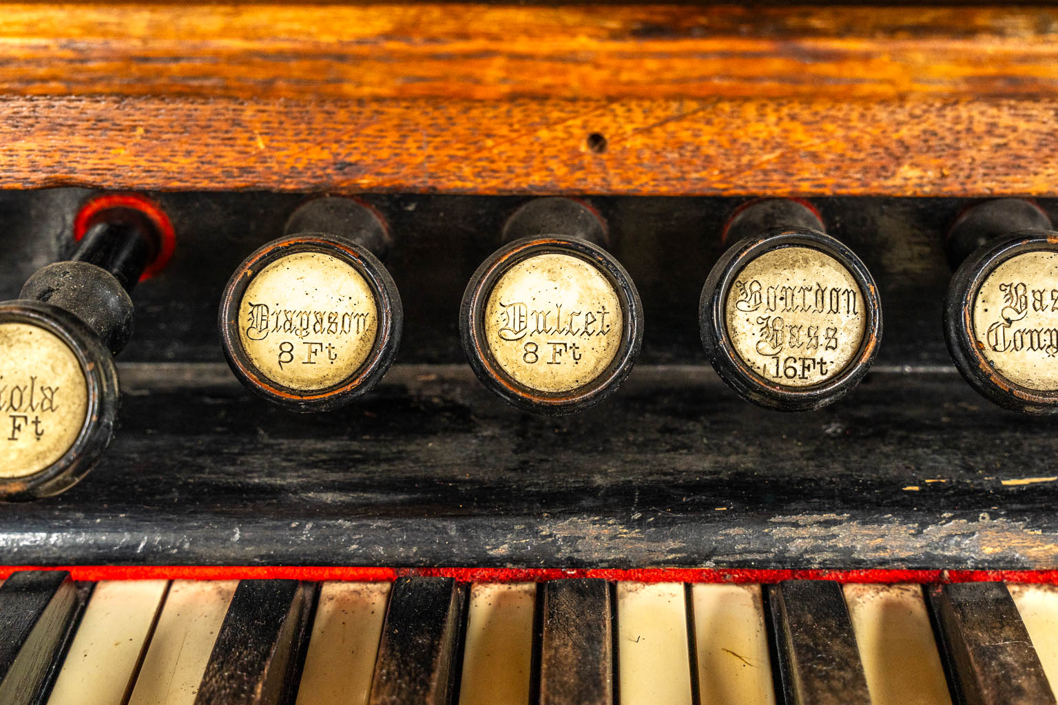 An antique organ, sculptured wood in Gothic Revival style. Circa 1900.