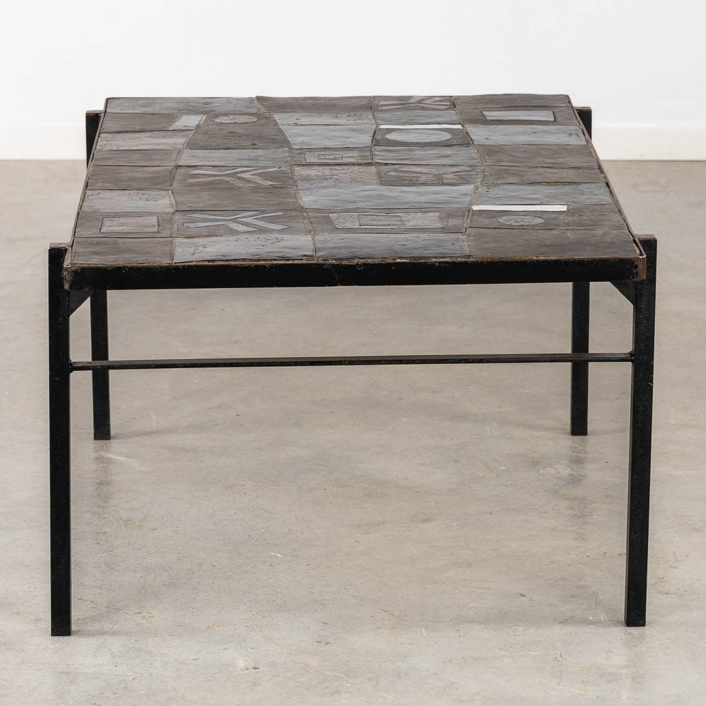 A mid-century coffee table, ceramic tiles on a metal base, circa 1970. (L:75 x W:110 x H:50 cm)