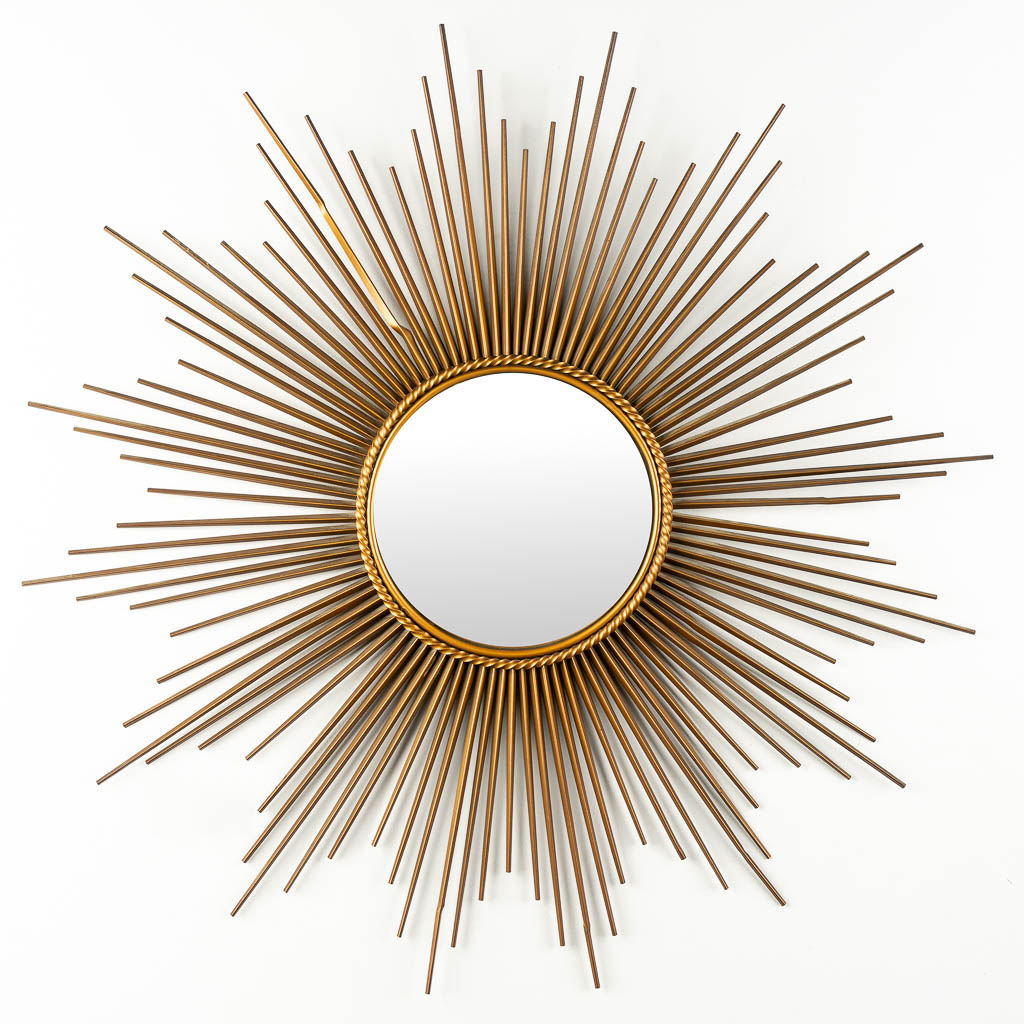 Chaty Vallauris, a large sunburst mirror. Gilt metal.  