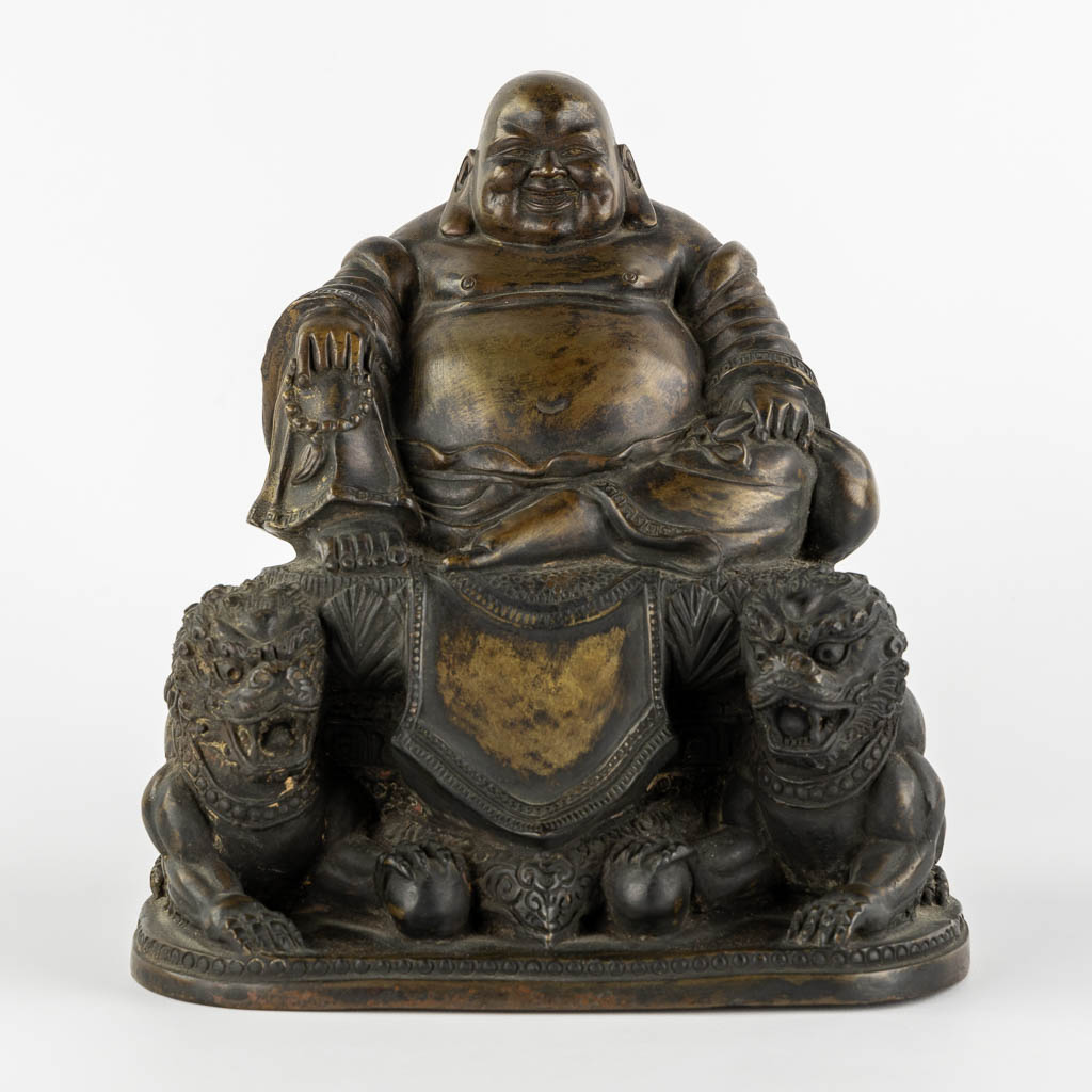 A 'Smiling Buddha with two temple guards', patinated bronze. (L:18,5 x W:23 x H:24 cm)