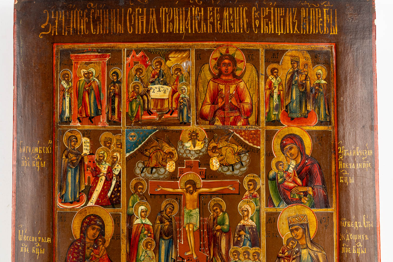 A large Russian icon with various scènes, Mother Gods, Crucifixion. 19th C. (W:30,5 x H:36 cm)