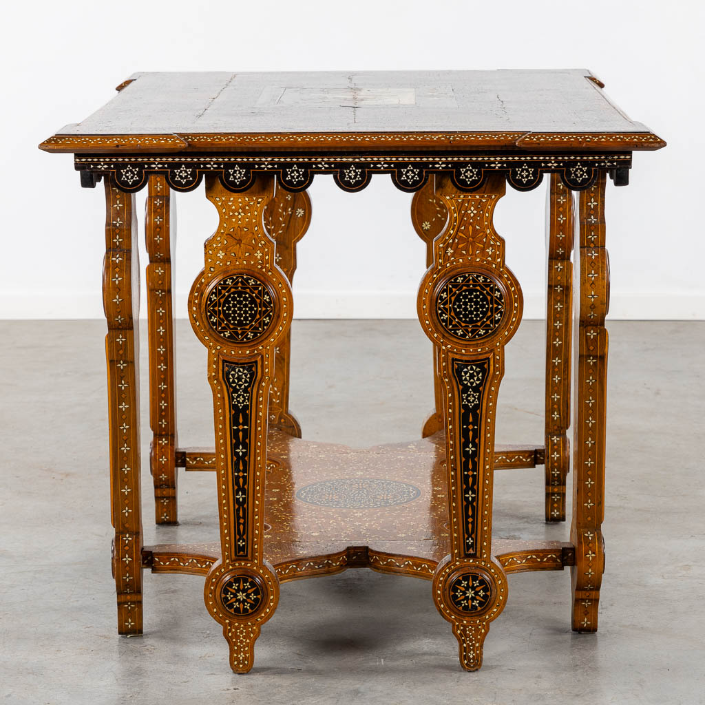 A Syrian table with two matching chairs, Marquetry and copper inlay, 19th C. (L:87 x W:121 x H:80 cm)