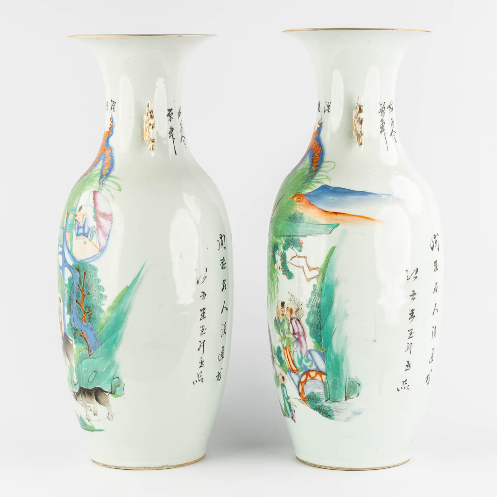 A pair of Chinese vases, decorated with playing children and kaligraphic texts. (H:59 x D:23 cm)