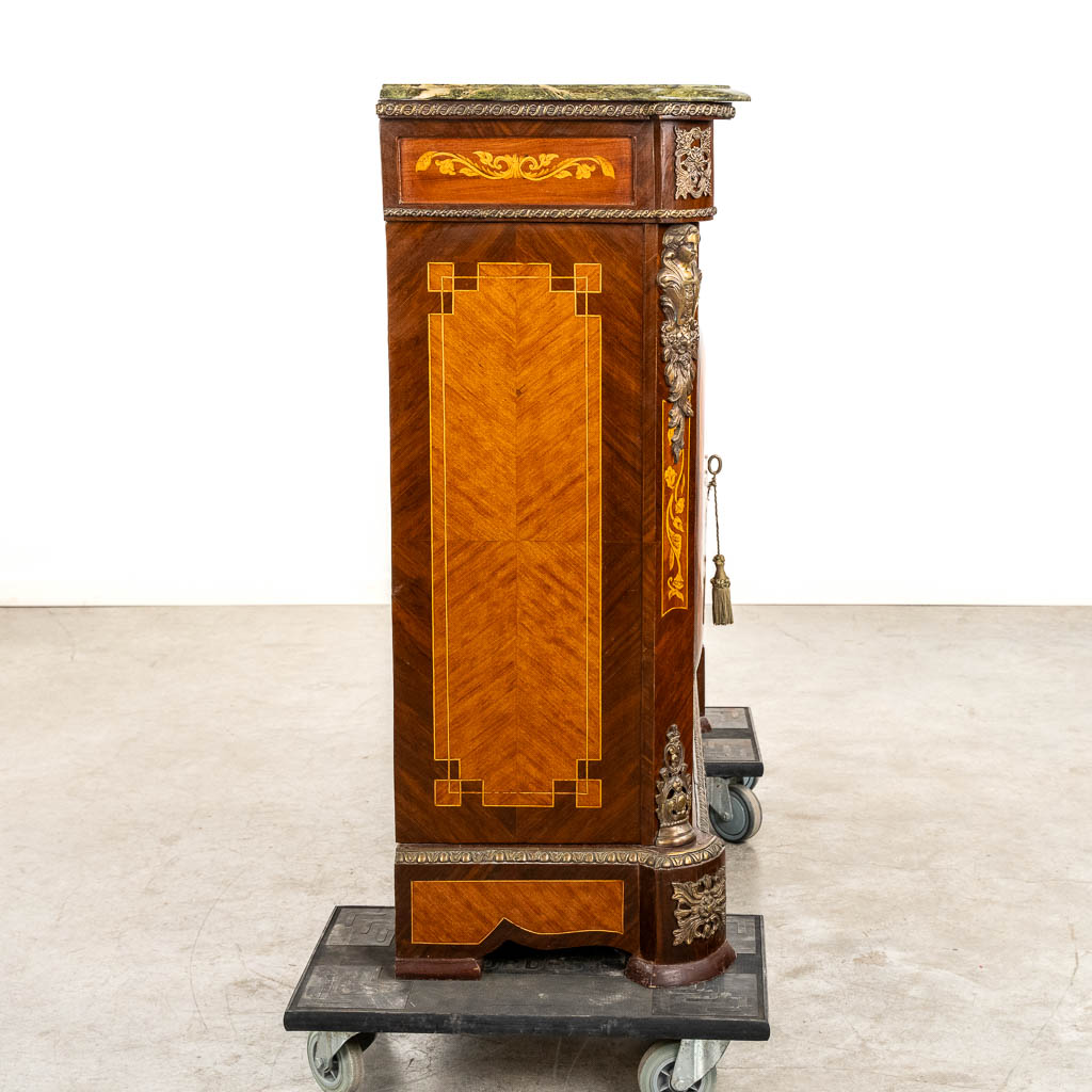 A two-door marquetry inlay cabinet, mounted with bronze and a marble. 20th C.