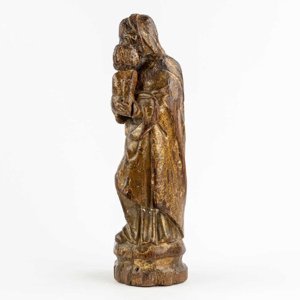 An antique wood-sculptured figurine of Madonna with a Child. 17th/18th C. (L:12 x W:16 x H:46 cm)