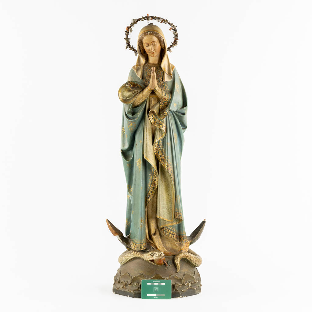 A Gothic Revival Virgin Mary on Crescent moon trampling the serpent, Polychrome plaster. Circa 1900. (H:81 cm)