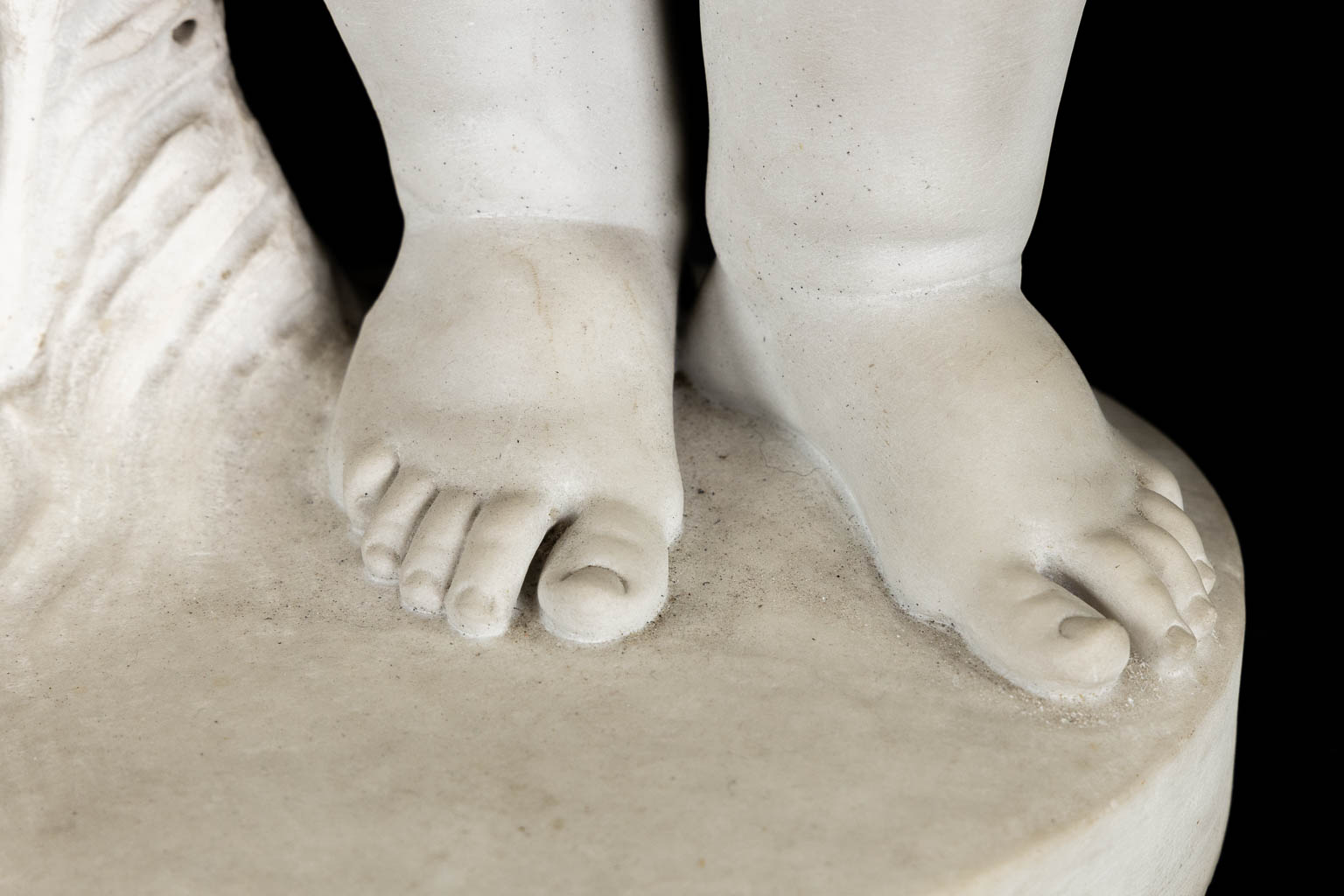 Boy with a rose, a Carrara marble sculpture, signed Vanet. 19th C. (L:35 x W:42 x H:92 cm)