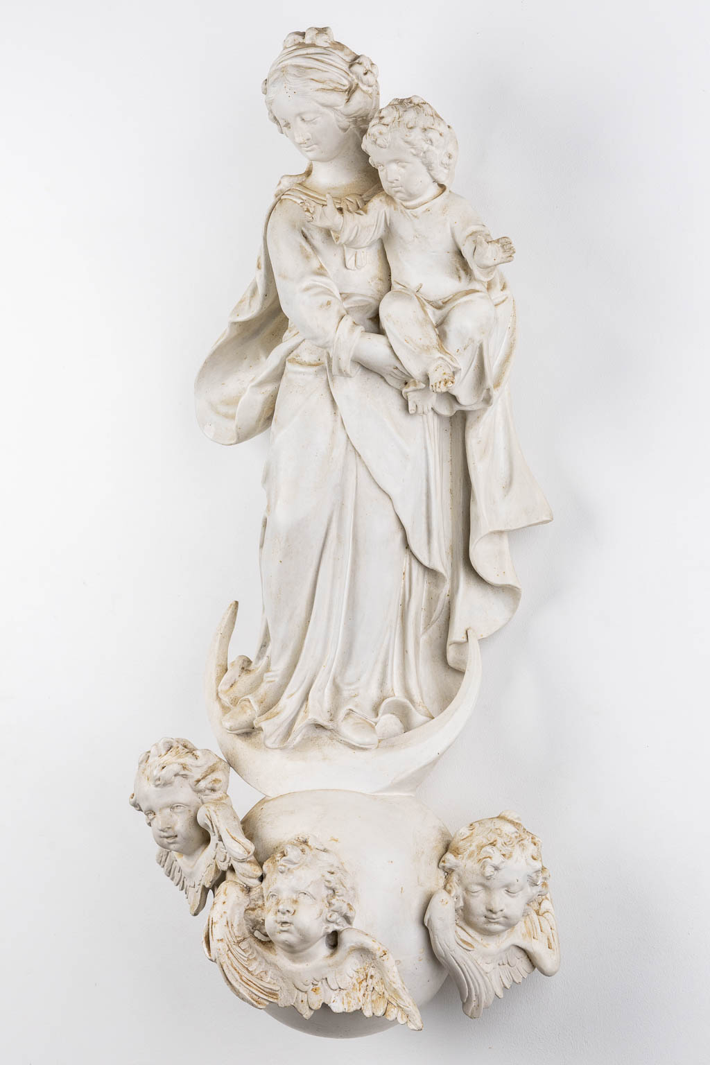 Madonna with a child, standing on a crescent moon, Baroque style. Circa 1900. (L:30 x W:42 x H:91 cm)