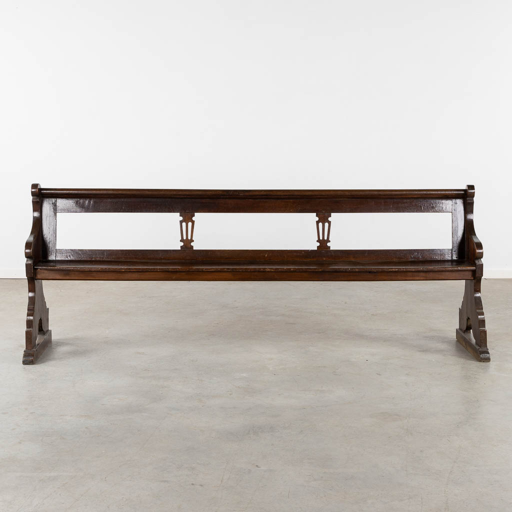 An antique Chruch bench, dark patinated oak, 18th C. (L:54 x W:239 x H:90 cm)