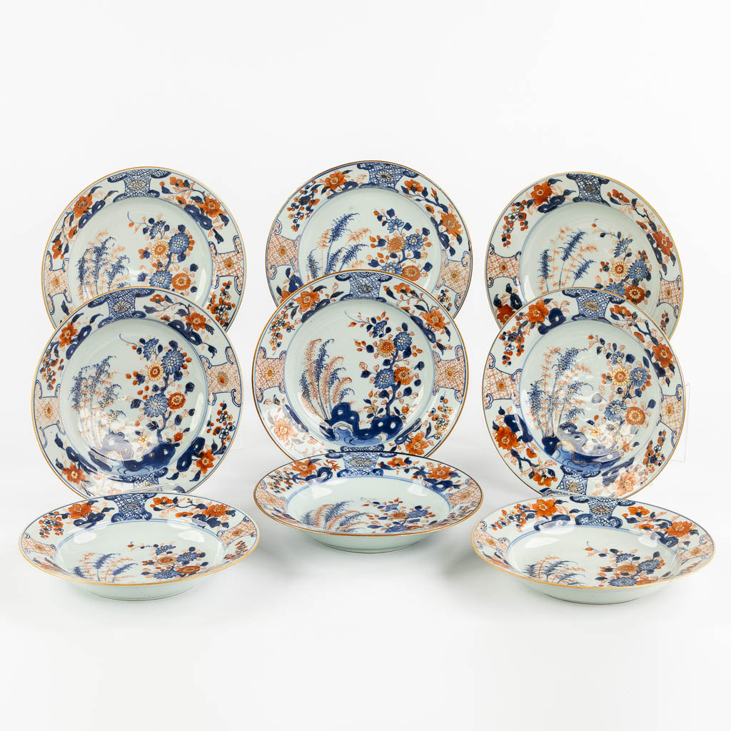 Nine Chinese Imari style plates with a floral decor. 18th C. (D:23 cm)