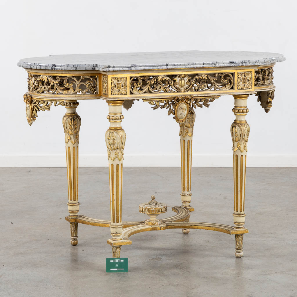 A wood-sculptured and patinated table with a grey marble, Louis XVI style. (L:65 x W:112 x H:80 cm)