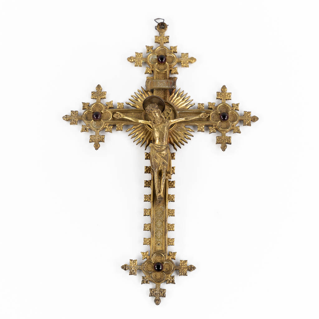 A crucifix, brass with cabochons, Gothic Revival. Circa 1900.