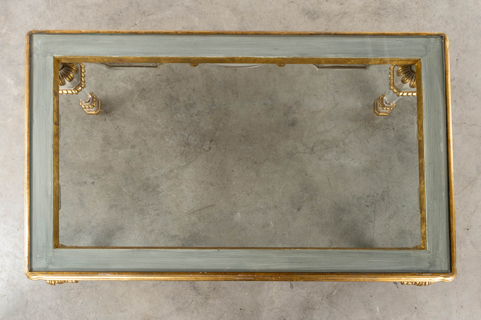 A Hollywood-Regency style coffee table, sculptured wood and plexiglass. (L:73 x W:120 x H:45 cm)