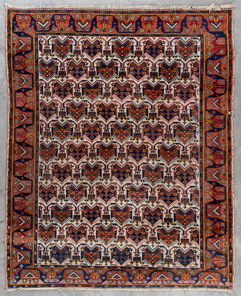 A Geometric Oriental hand-made carpet. (L:192 x W:157 cm)