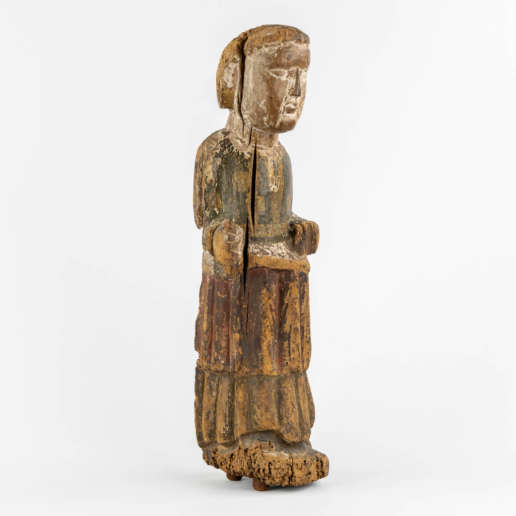 An antique wood sculpture of a Deacon, Roman period, possibly Catalonia. 12th C. (L:14 x W:15 x H:57 cm)