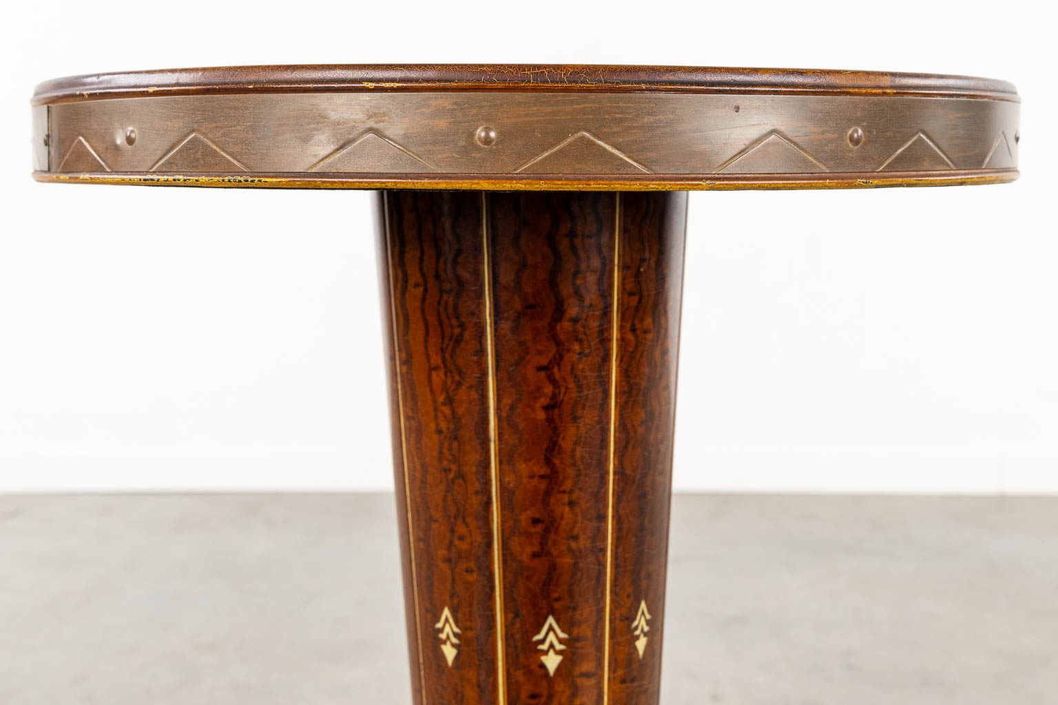 A round side table, patinated metal and wood, Art Deco/Bauhaus. (H:66 x D:47 cm)