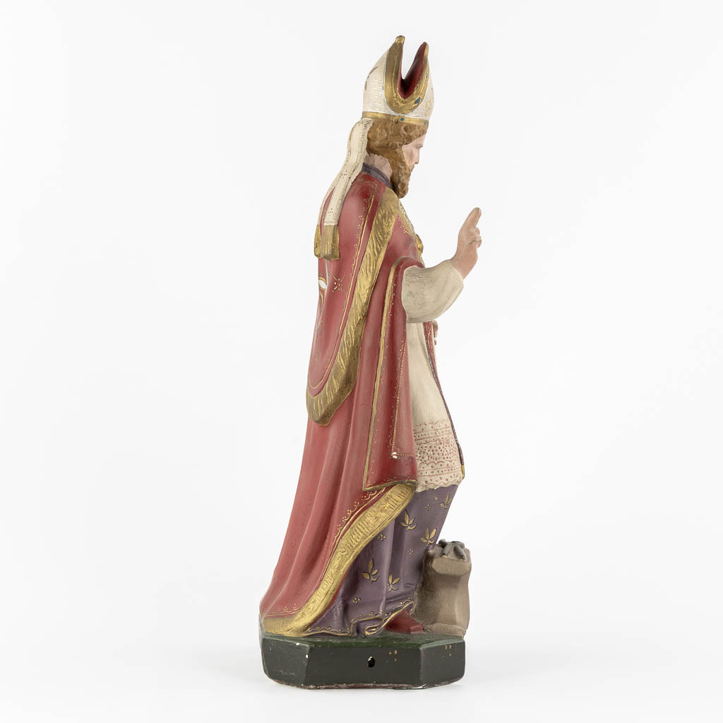 Saint Eligius, polychrome plaster. (W:19 x H:52 cm)